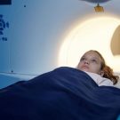 adorable-child-moving-into-mri-scan-machine-before-2023-11-27-05-05-50-utc